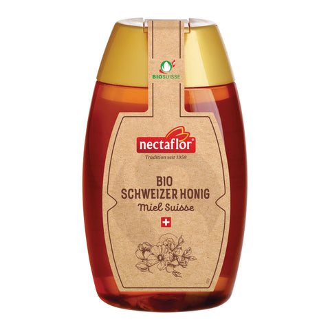 Honigflasche mit goldfarbenem Deckel und braunem Etikett mit der Aufschrift 'nectaflor BIO SCHWEIZER HONIG Miel Suisse' und einem Blumenmotiv