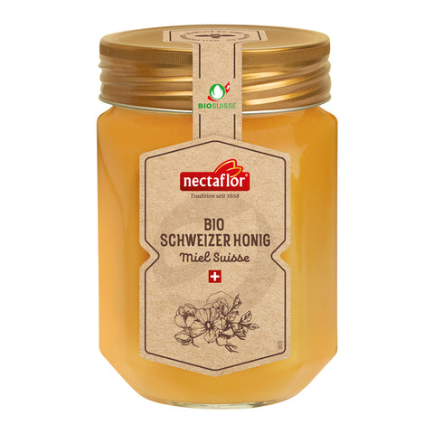 Glas mit goldfarbenem Deckel und Etikett mit der Aufschrift 'nectaflor BIO SCHWEIZER HONIG Miel Suisse' und einem Blumenmotiv