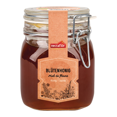 Glas mit braunem Blütenhonig und braunem Etikett mit der Aufschrift 'nectaflor BLÜTENHONIG Miel de fleurs flüssig - liquide'