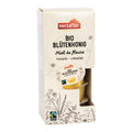 Verpackung mit mehreren kleinen Portionen Bio-Blütenhonig der Marke nectaflor mit Fairtrade-Siegel und floralen Illustrationen