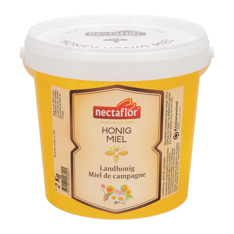 Gelber 2-kg-Plastikeimer mit weißem Deckel und Etikett der Marke nectaflor mit der Aufschrift 'Honig Miel Landhonig Miel de campagne'