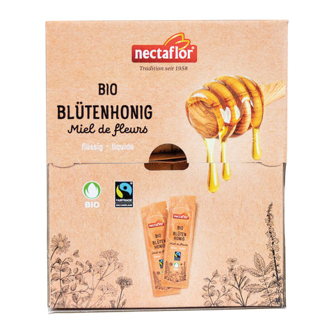 Verpackung mit dem Schriftzug 'nectaflor Tradition seit 1958' und 'BIO BLÜTENHONIG Miel de fleurs flüssig' sowie zwei Honigtüten und einer Honiglöffel-Illustration mit tropfendem Honig