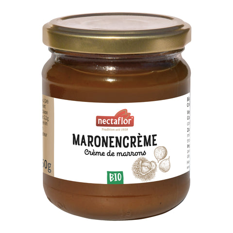 Glas mit goldfarbenem Deckel, gefüllt mit brauner Bio-Maronencreme. Auf dem Etikett steht „Maronencrème / Crème de marrons“ unter dem Nectaflor Logo. Daneben sind Kastanien abgebildet, darunter ein grünes Bio-Symbol.