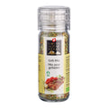 Transparente Gewürzmühle mit durchsichtigem Deckel. Auf dem Etikett steht „Grill-Mix / Mix pour grillades“ unter dem Swiss Alpine Herbs Logo. Im Glas sind grobe Kräuter, Gewürze und Salzkristalle sichtbar. Unten sind ein gegrilltes Fleischstück, rote Peperoni sowie das Bio-Logo abgebildet.