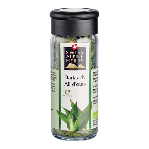 Transparente Gewürzmühle mit schwarzem Deckel. Auf dem Etikett steht „Bärlauch / Ail d’ours“ unter dem Swiss Alpine Herbs Logo. Im Glas sind getrocknete grüne Kräuter sichtbar. Unten ist eine Abbildung von Bärlauchblättern sowie das Bio-Suisse-Logo zu sehen.