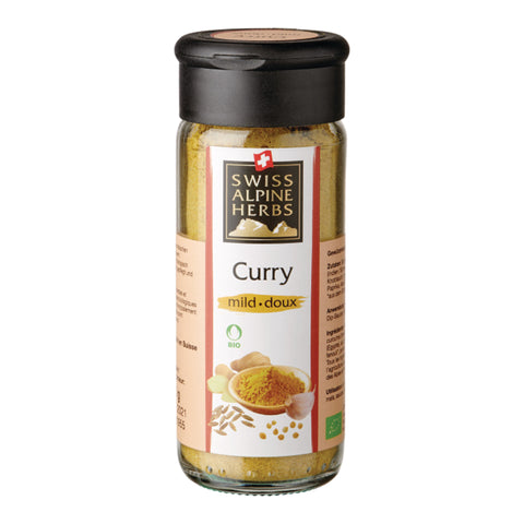 Glasflasche mit schwarzem Deckel und Etikett 'SWISS ALPINE HERBS Curry mild doux' mit Bio-Siegel und Abbildung von Curry-Gewürz und Gewürzbestandteilen