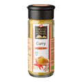 Glasflasche mit schwarzem Deckel und Etikett 'Swiss Alpine Herbs Curry scharf fort' mit Abbildung von Currygewürz und Chilischoten