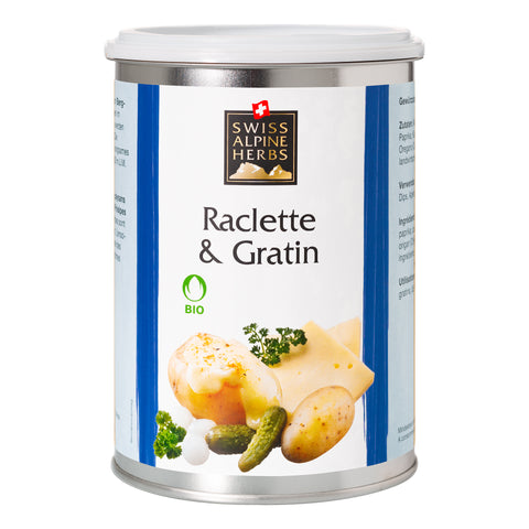Weisse Gewürzdose mit blauen Seitenstreifen. In der Mitte steht „Raclette & Gratin“ unter dem Swiss Alpine Herbs Logo. Unten sind geschmolzener Käse, Kartoffeln, Essiggurken sowie das Bio-Logo abgebildet.