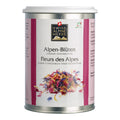 Weisse Dose mit rosa Seitenstreifen. In der Mitte steht „Alpen-Blüten / Fleurs des Alpes“ unter dem Swiss Alpine Herbs Logo. Unten ist eine bunte Mischung aus getrockneten Blütenblättern sowie das Bio-Suisse-Logo abgebildet.