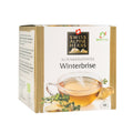 Verpackung von Swiss Alpine Herbs Alpenkräutertee Winterbrise mit dampfender Teetasse, Ingwer und Kräutern