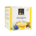 Verpackung des Swiss Alpine Herbs Alpenkräutertees Alpenglanz mit Teetasse und Blütenmotiv