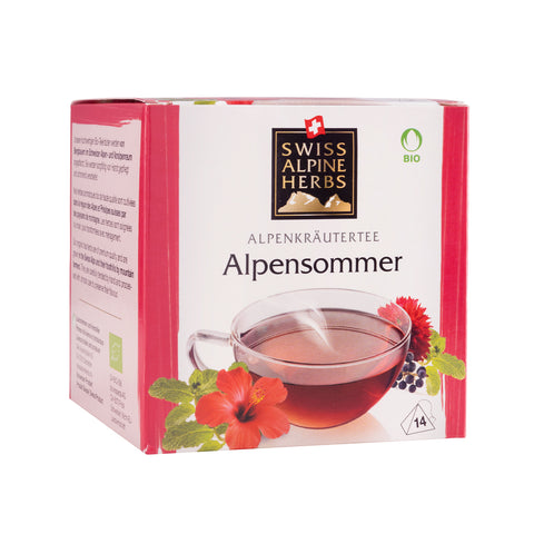 Packung mit Alpensommer-Alpenkräutertee der Marke Swiss Alpine Herbs mit Teetasse und Blütenmotiven