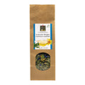 Braune Papiertüte mit Sichtfenster und Etikett für losen Alpenkräutertee der Marke Swiss Alpine Herbs