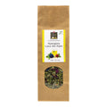 Braune Verpackung mit Sichtfenster und Etikett für Alpenkräutertee der Marke Swiss Alpine Herbs mit der Aufschrift 'Alpenglanz Lueur des Alpes'