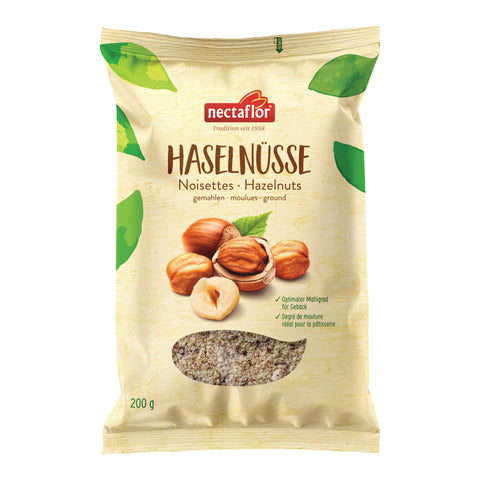Packung gemahlener Haselnüsse der Marke nectaflor mit Haselnussabbildungen und Sichtfenster