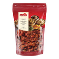 Rote Verpackung mit durchsichtiger Front, die getrocknete halbierte Kirschtomaten zeigt, Aufschrift 'nectaflor Kirschomaten-Hälften Cherry Tomato Halves'