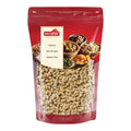 Rote Verpackung mit transparentem Sichtfenster, gefüllt mit Cashewkernen, darauf ein Etikett mit der Marke 'nectaflor' und der Aufschrift 'Cashews Noix de cajou Cashew Nuts'