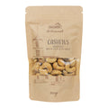 Braune Verpackung mit Sichtfenster, darin Cashewkerne, Aufdruck mit Schriftzug "nectaflor Artisanal CASHEWS MEERSALZ NOIX DE CAJOU AU SEL MARIN 100g" und Zeichnung eines Kirchturms