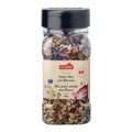 Plastikflasche mit schwarzem Deckel gefüllt mit Salat-Mix und getrockneten Blüten, Etikett mit der Aufschrift 'nectaflor Schweizer Salat-Mix mit Blumen Mix pour salade aux fleurs suisse 280g'