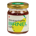 Glas mit goldfarbenem Deckel und Etikett mit gelber Birne und Schriftzug "Winterhilfe BIRNEL hilft"