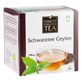 Weiße Verpackung des Bio-Schwarztees Ceylon von Finest Organic Tea mit Teetasse, grünen Blättern und 14 Teebeuteln.