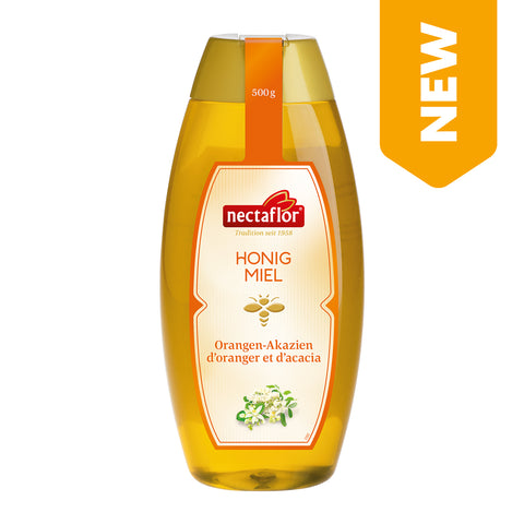 Flasche mit flüssigem Orangen-Akazienhonig der Marke nectaflor mit 500 g Inhalt und Aufschrift 'NEW'